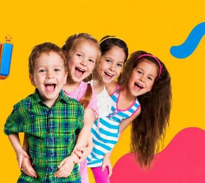 Four smiling children at BiliBii Academy